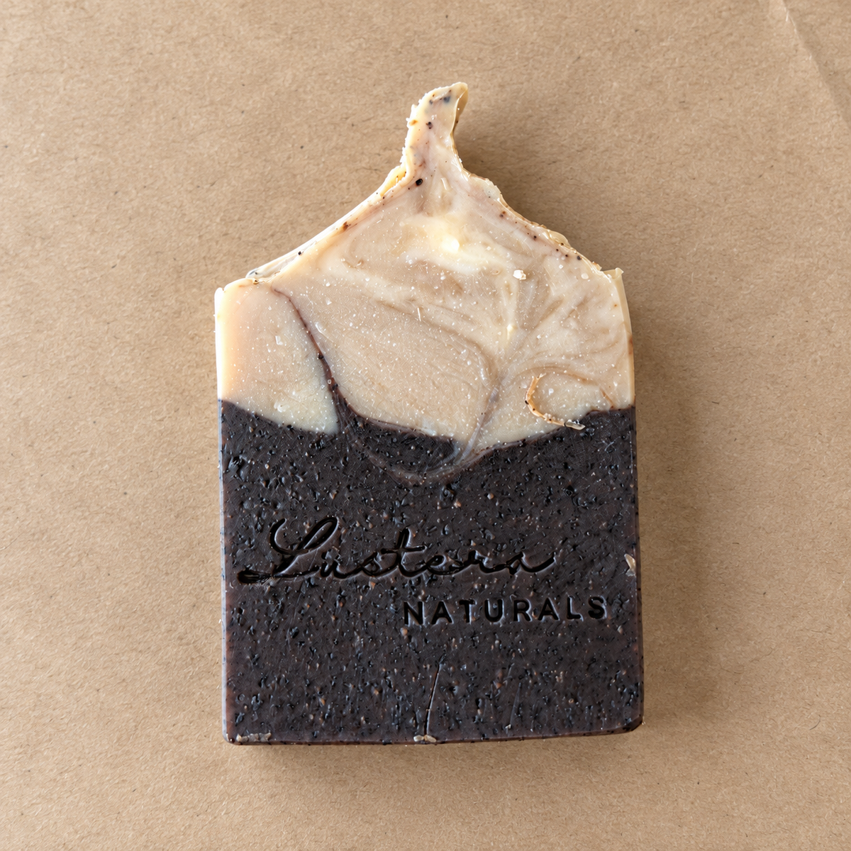 Dark Roast soap bar with cream and dark brown swirls on plain kraft paper